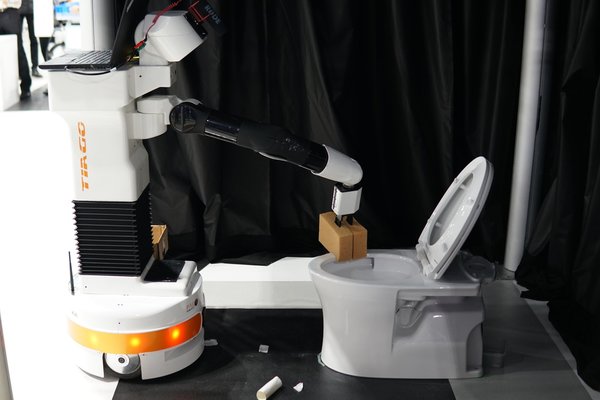 Cleaning a toilet at World Robot Summit 2018, Tokyo